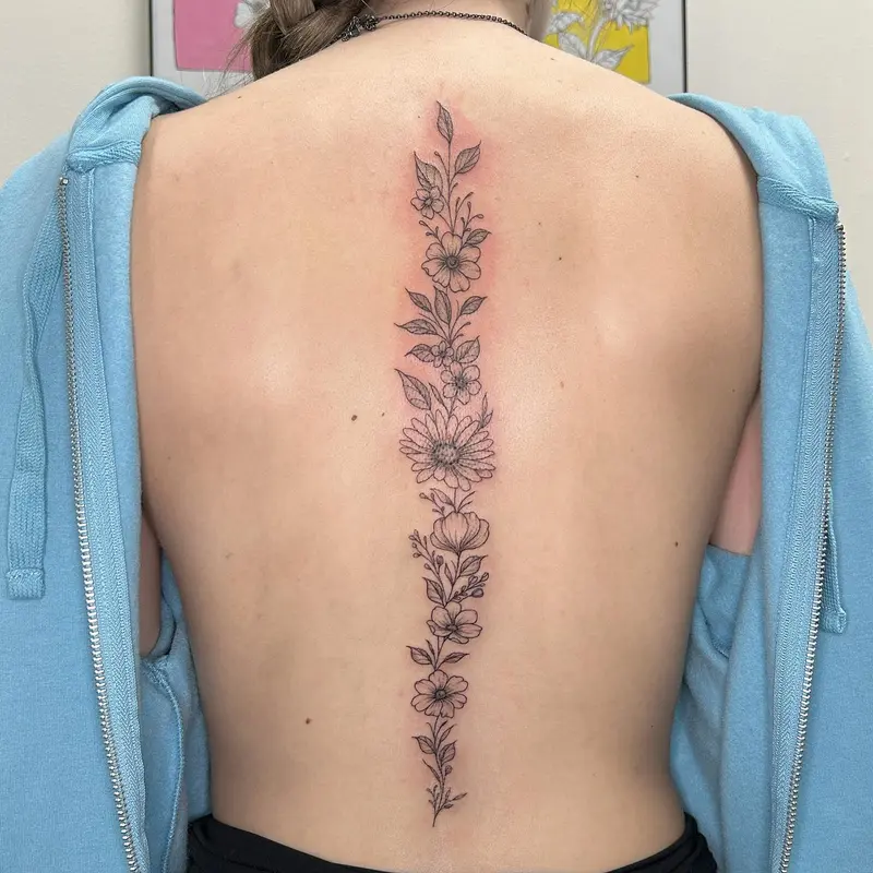 Loved doing this floral spine piece last week!! * * * #spinetattoo #flowertattoo #flowers #natureart #naturetattoo…