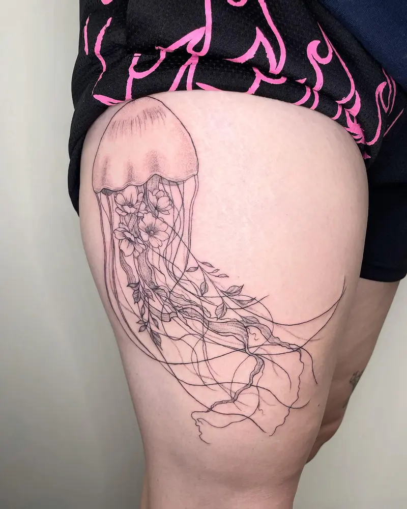 Delicate floral jellyfish from this week * * * #jellyfishtattoo #floraljellyfish #thighpiece #thightattoo…