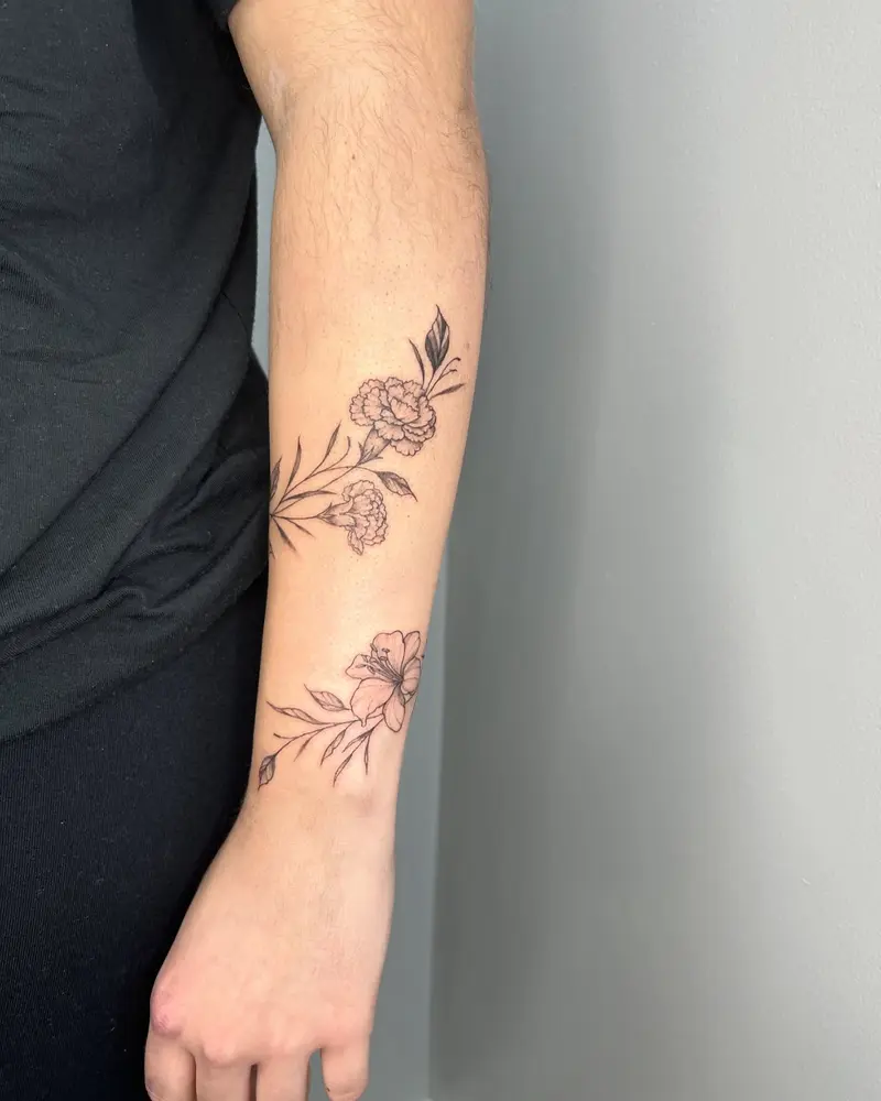Pretty little wrap around done recently 😍 * * * #vinetattoo #wraparoundtattoo #vines #carnations #lilies #flowers…