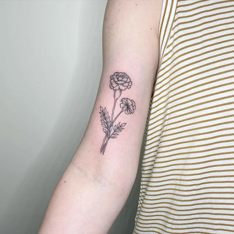 A couple of marigolds done recently. * * * #marigolds #planttattoo #floraltattoo #finelinework #finetattoo #tattoosnob…