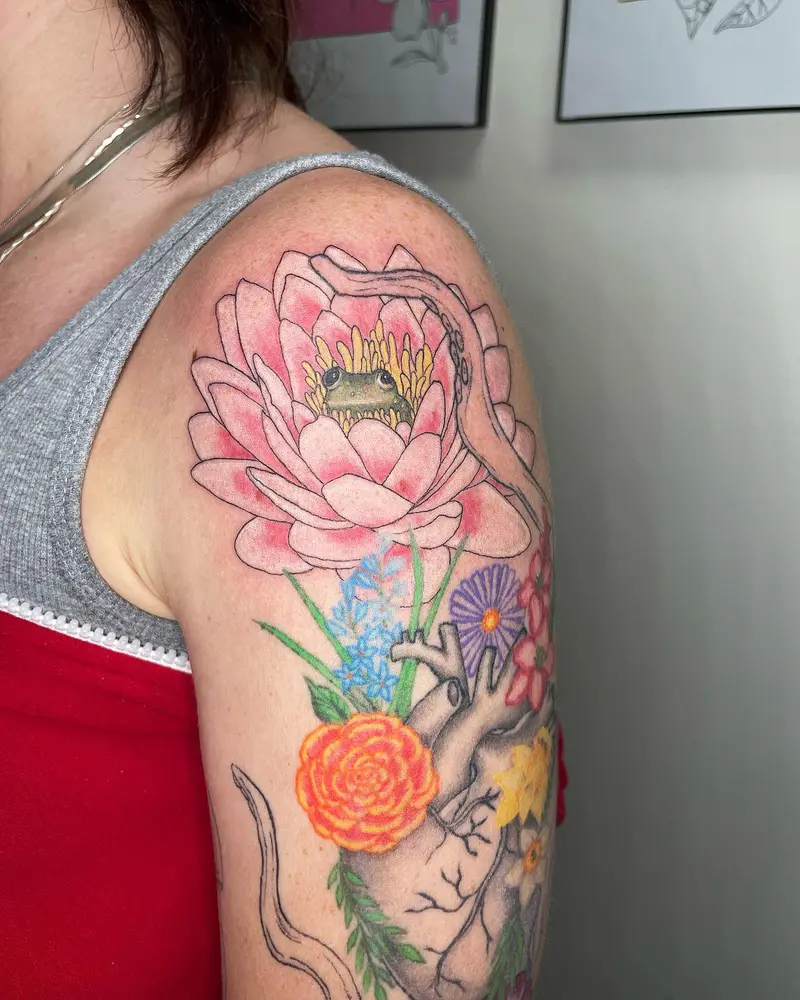 Added this cute frog friend to this colorful sleeve I’ve been working on. * * * #frogtattoo #lotustattoo #lotus #frog…