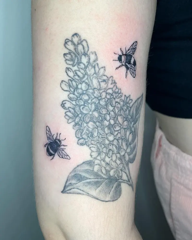 Added some cute new friends to a healed lilac from a couple years ago * * * #bees #beetattoo #lilactattoo #armtattoo…