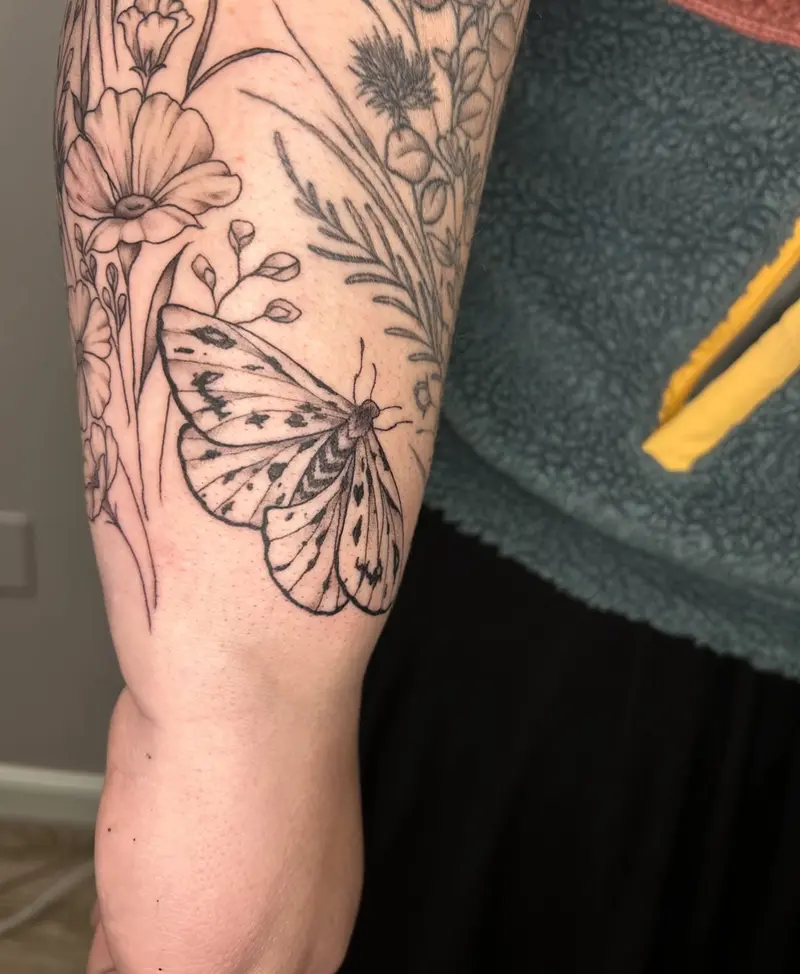 Some wildflowers to bring to forearm together 😍 love how this is coming together * * * #butterflytattoo #wildflowers…