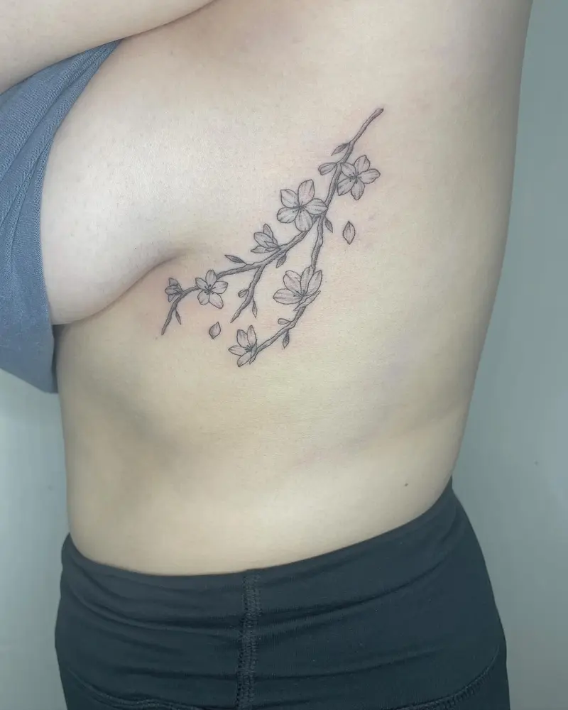 Obsessed with the placement of this one honestly. And the cherry blossoms. 🌸 * * * #cherryblossomtattoo…
