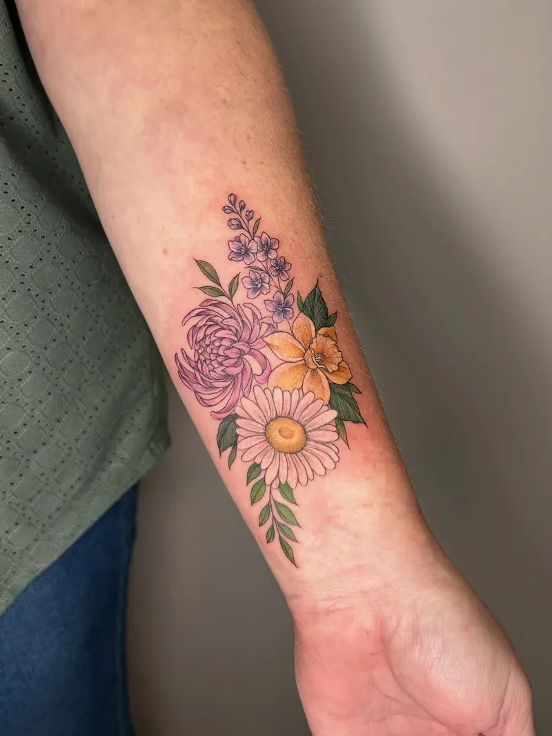 A little pop of color for the feed 🌿#birthflowertattoo #colortattoo #flowerstagram #armtattoo #colorfulflowers