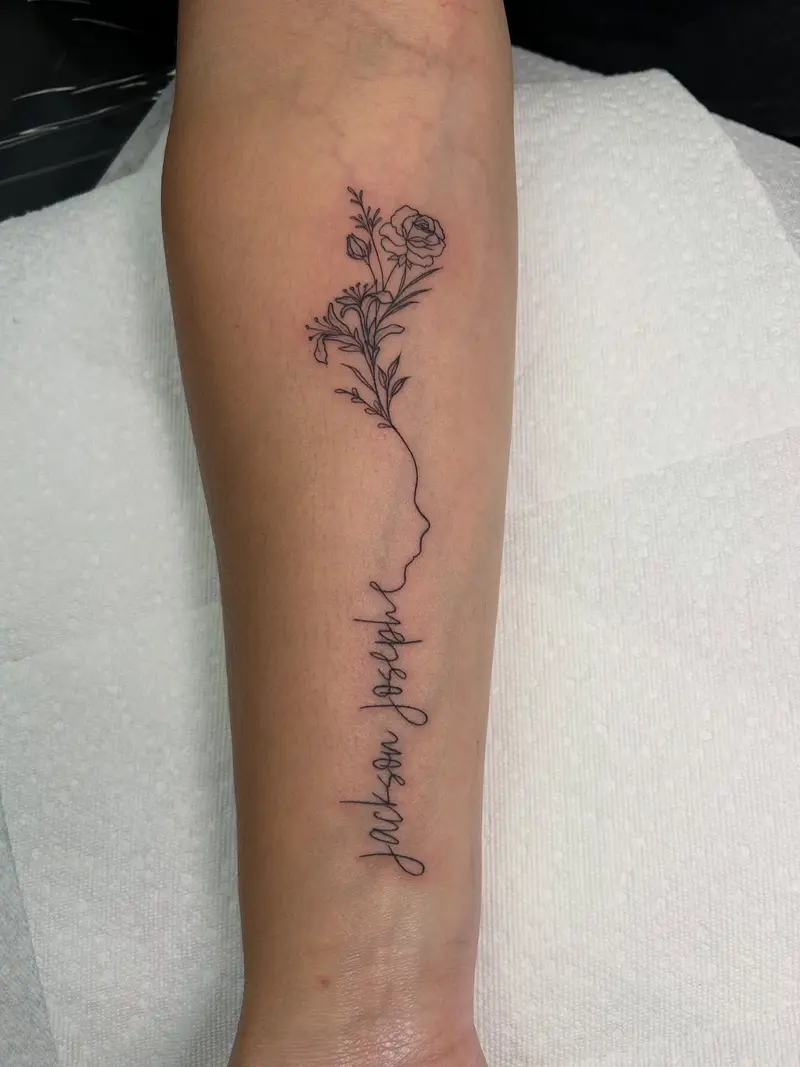 Baby’s profile outline with his name and birth flowers 🥰 so sweet * * * #babyprofile #babytattoo #birthflowers…