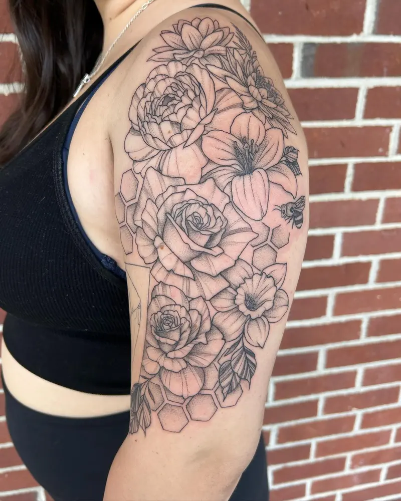 Floral half sleeve I got to do over the weekend. I love how it frames the existing tattoo on the inner part of her…