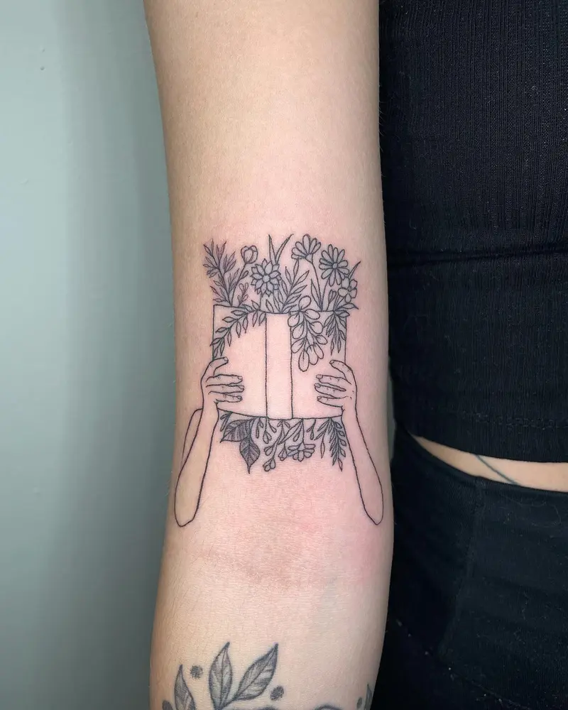 Cute book with flowers from the other day * * * #booktattoo #flowerbook #inkedmag #eternalink @eternalink…