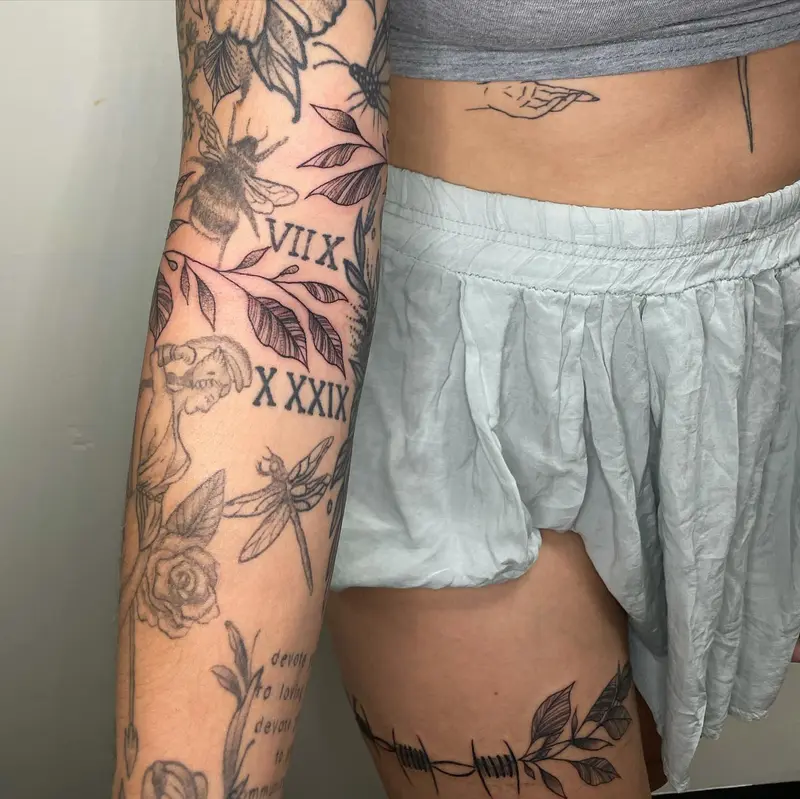 Keep swiping there’s lots to see * * * #coveruptattoo #barbedwire #leaves #violet #sleeve #legtattoo #armtattoo