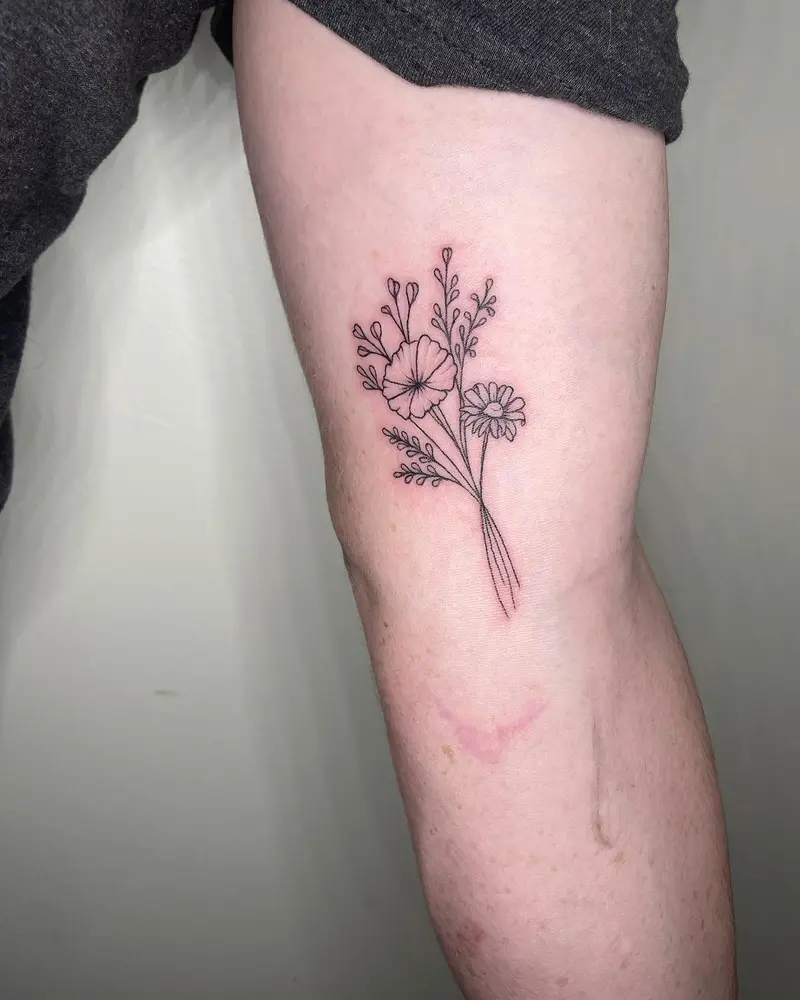 Some cute matching birth flowers from last week 🌸 * * * #matchingtattoos #birthflowertattoo #coupletattoos #armtattoo…